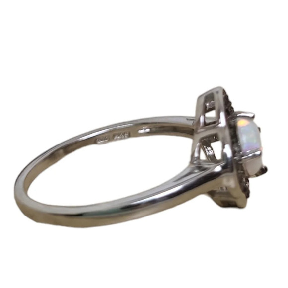 Sterling Silver Garnet Created White Opal Flower Ring - Picture 15 of 16